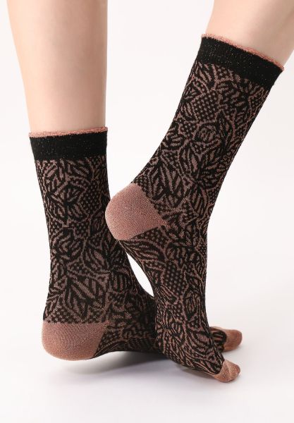Eleganta sockor med glittrande mönster och mjuk viskos från Oroblu