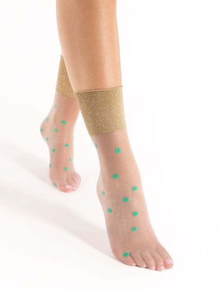 Transparenta sockor med mintgrönt prickmönster och muddar med lurexeffekt från Fiore